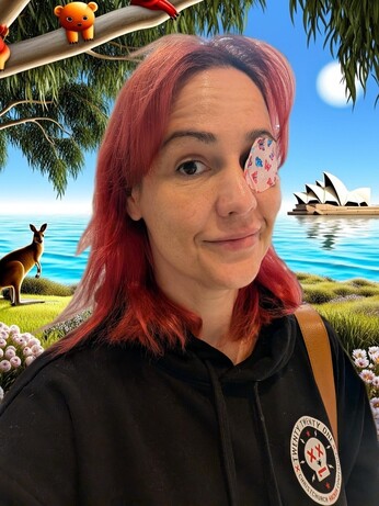 Woman with red hair and eyepatch with ridiculous Australian vista as background